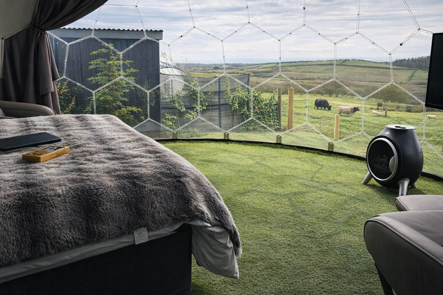Bed inside Domes I, II and III looking out across fields